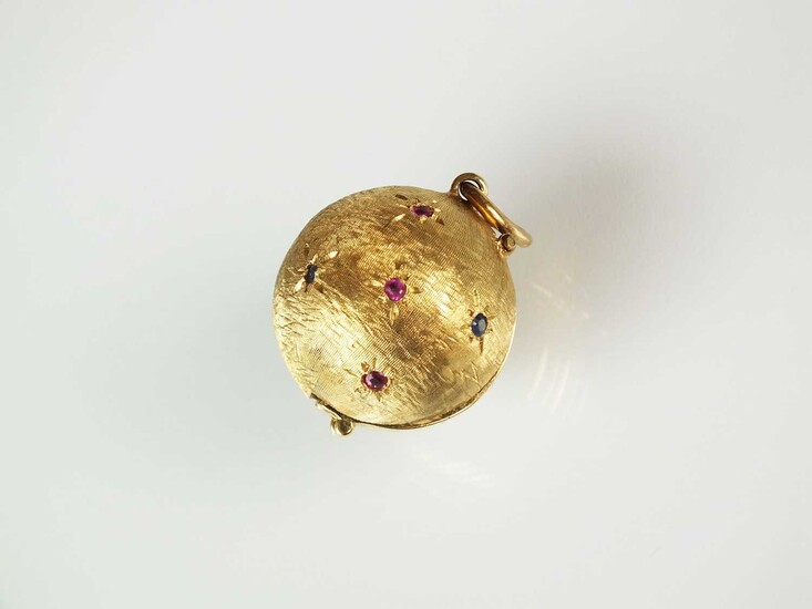 A sapphire and ruby orb locket