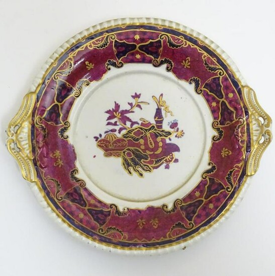 A twin handled Spode plate in the pattern Imperial.
