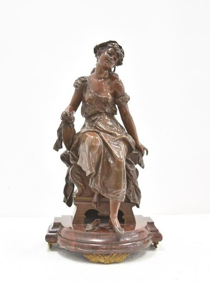 ANTIQUE BRONZE SEATED WOMAN TAKING SHOE OFF