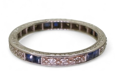 An 18ct white gold sapphire and diamond eternity ring size Q...
