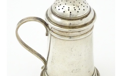 An American sterling silver pepperette modelled as a flour s...