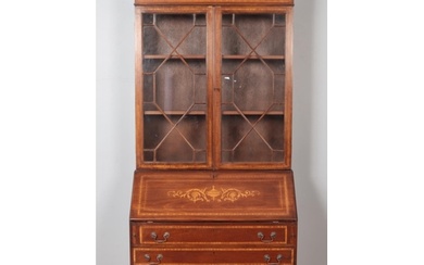 An Edwardian mahogany bureau bookcase. With satinwood inlay ...