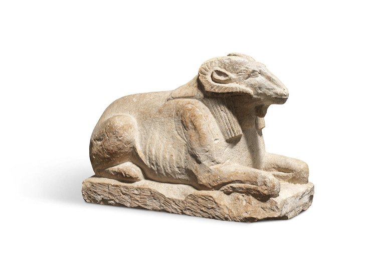 An Egyptian limestone ram-headed sphinx