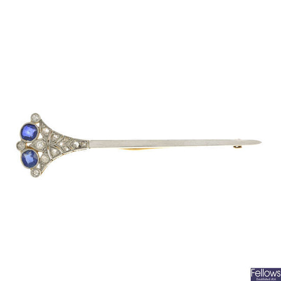 An early 20th century platinum and gold sapphire and vari-cut diamond brooch.