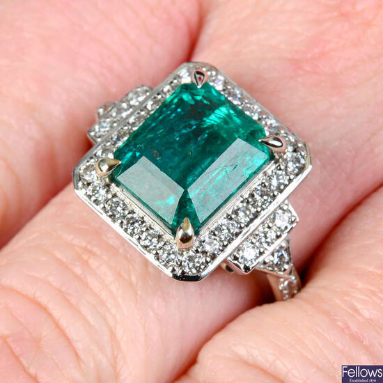 An emerald and brilliant-cut diamond geometric dress ring.