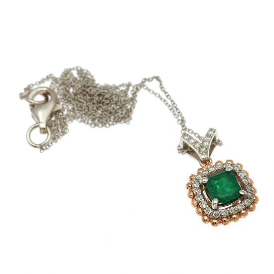 An emerald and diamond pendant set with an emerald encircled by numerous diamonds, mounted in 14k white- and rose gold. Chain of 14k white gold incl. L. 45 cm.