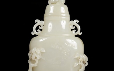 An exquisite white jade vase with auspicious animal patterns