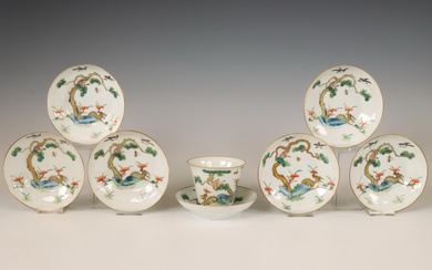 China, a set of seven famille verte auspicious 'deer and monkey' saucers with one cup, late 19th/ early 20th century