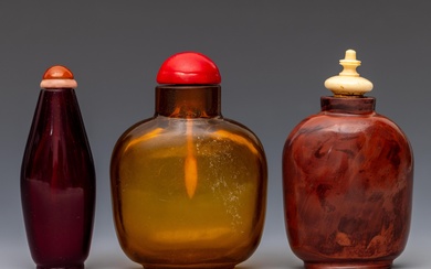 China, three glass snuff bottles and stoppers, late Qing dynasty (1644-1912)