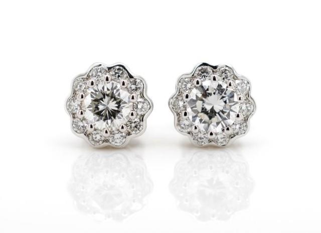 Diamond cluster and 18ct white gold earrings marked AU 750. ...