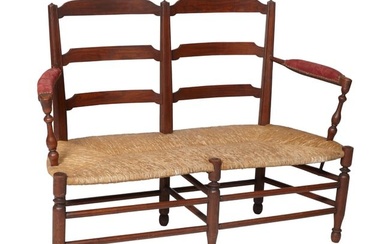 French Provincial Walnut Settee, 19th c., the ladder back shaped slats between incised reverse