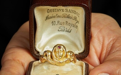 GUSTAVE SANDOZ - ANNEES 1910 BAGUE FEMME AUX LONGS CHEVEUX A rubis and 18K yellow gold ring by Gustave SANDOZ, circa 1910. French as...