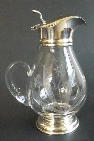 Hand cut glass cruet with silver base and lid