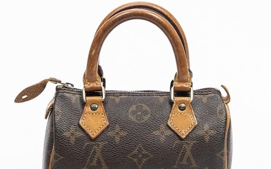 Louis Vuitton: A "Mini Speedy" bag of brown monogram canvas with brown leather trimmings, gold tone hardware and two handles. – Bruun Rasmussen Auctioneers of Fine Art