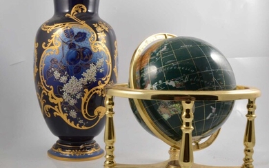 Modern globe set with natural stones and blue ground vase.
