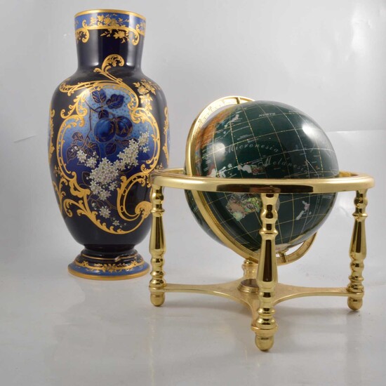 Modern globe set with natural stones and blue ground vase.