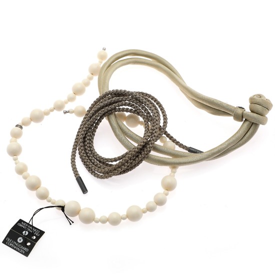 Ole Lynggaard: A collection comprising of a Sweet Drop bracelet, a braided string of silk and a necklace. (3)