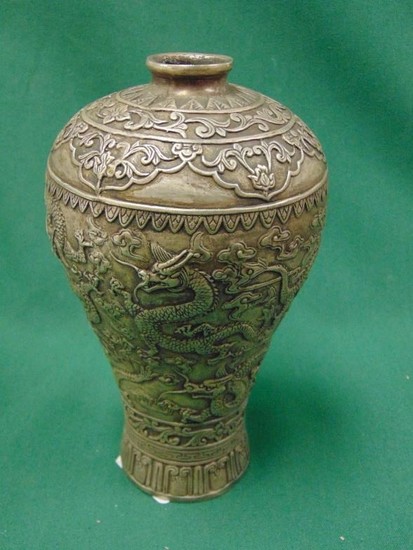Oriental cast white metal vase of baluster form, decorated i...