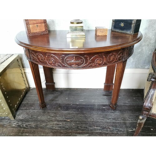 Pair of mahogany demi -lune side tables with carved frieze r...