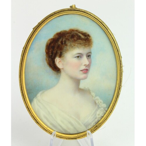 Portrait miniature of a 19th Century Lady. In a gilt oval f...