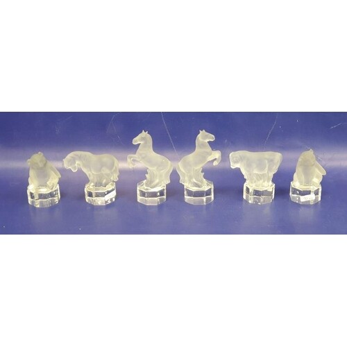 Six glass models of animals, each frosted with clear glass b...