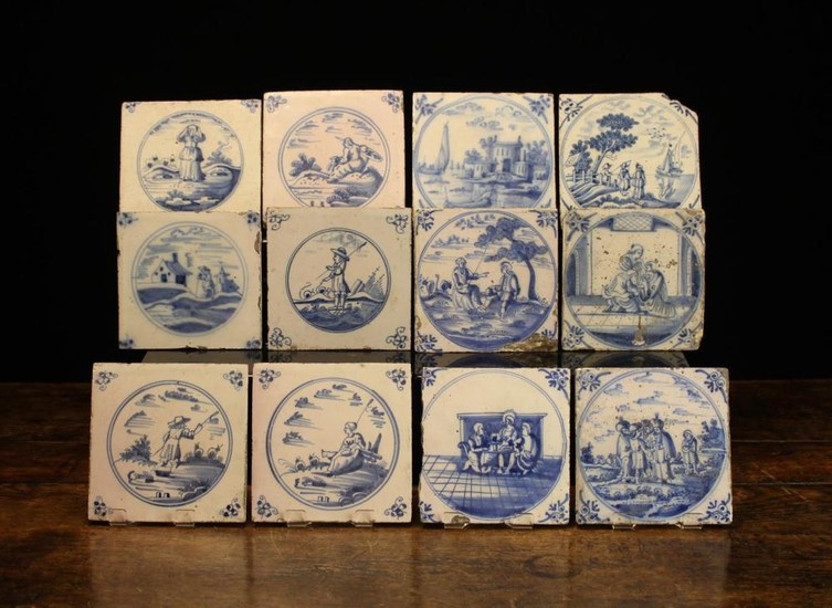 Twelve Early 18th Century Blue & White Delft Tiles painted with figural scenes in roundels and decor