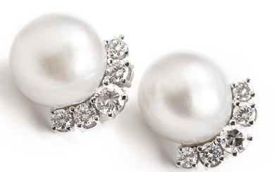V. Holmstrup: A pair of Mabé pearl and diamond ear clips each set with a cultured Mabé pearl and numerous diamonds, mounted in 14k white gold. F-G/VVS. (2)