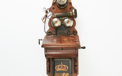 WALL TELEPHONE, telephone set for end or intermediate station, AB L.M. Ericsson, Figure No. 1 or 3 of the 1889 catalogue, case in walnut, battery cover in lithographed steel plate, with decoration of the Great National Coat of Arms.