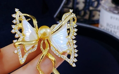 White mother-of-fritillary butterfly brooch with gold pearls