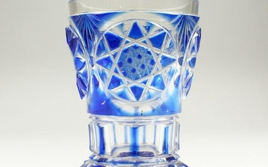A BOHEMIAN BLUE TINTED BEAKER-VASE with cut base. 5ins