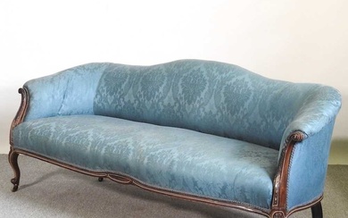 A 19th century carved mahogany and blue upholstered hump back...