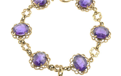 A 9ct gold fancy-link bracelet, with amethyst highlights and drop.