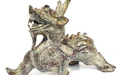 A CHINESE BRONZE FIGURE OF A MYTHICAL BEAST