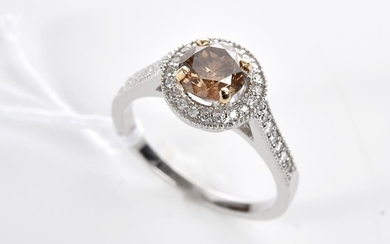 A COGNAC DIAMOND AND DIAMOND RING IN 18CT TWO TONE GOLD, THE CENTRE STONE WEIGHING 1.17CTS,SIZE O, 3.8GMS