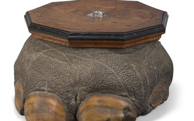 A Ceylonese satinwood and ebony mounted elephant foot box, late 19th/early 20th century, the nine-sided moulded top with white-metal ring handle opening to a satinwood-lined interior, 23cm high, 38cm wide