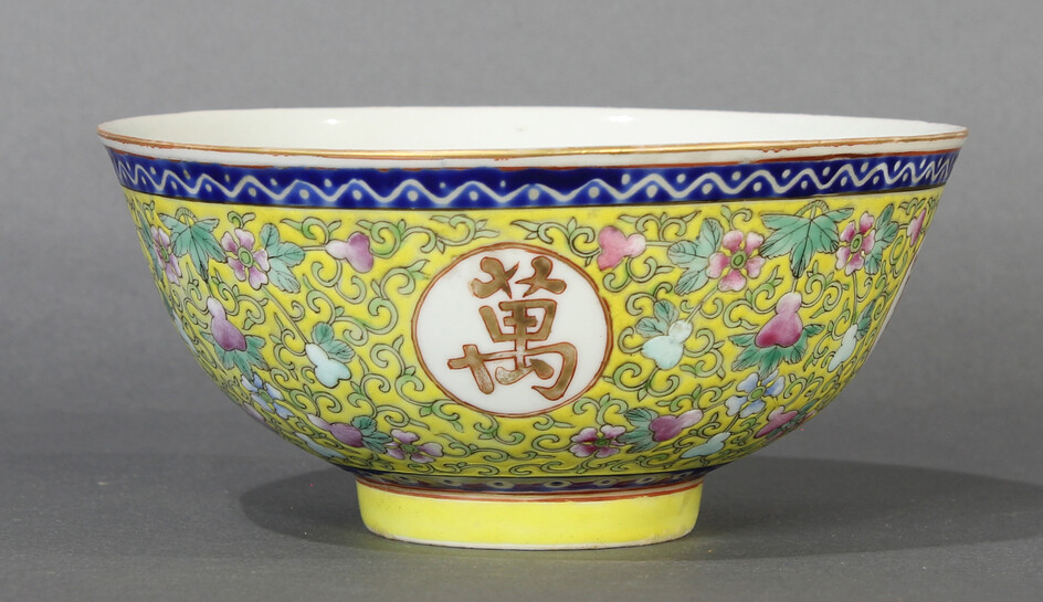 A Chinese Famille Rose yellow ground bowl