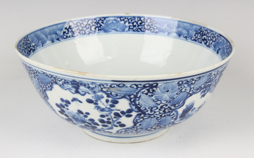 A Chinese blue and white porcelain circular bowl, mark of Kangxi but late 19th century, painted with