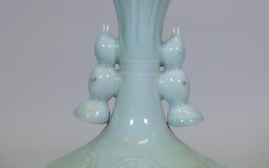 A Chinese celadon glazed lotus vase, blue seal mark...