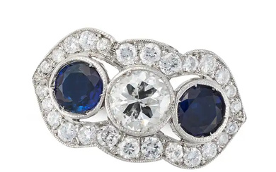 A DIAMOND AND SAPPHIRE DRESS RING set with a round ...