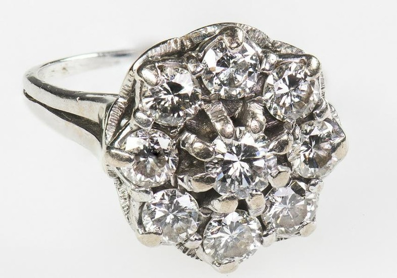 A DIAMOND CLUSTER RING, CIRCA 1975 The tiered cluster