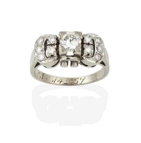 A Diamond Cluster Ring, the buckle motif set throughout...
