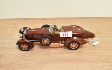 A Franklin Mint 1:24 scale Die-cast, 1924 Hispano-Suiza Tulipwood with tag and certificates, with
