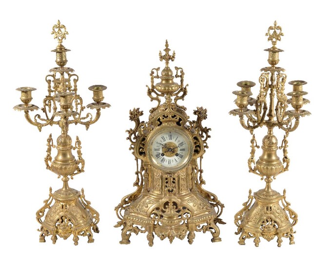 A French Rococo Revival gilt metal clock garniture