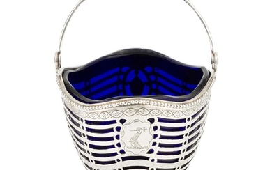 A George III silver swing handled sugar basket, with beaded...