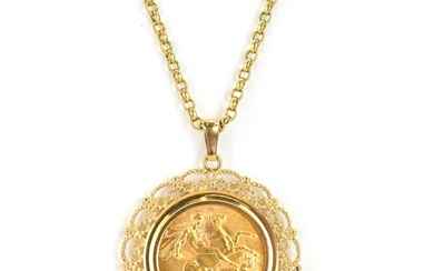 A George V 1925 full sovereign in 9ct gold circular...