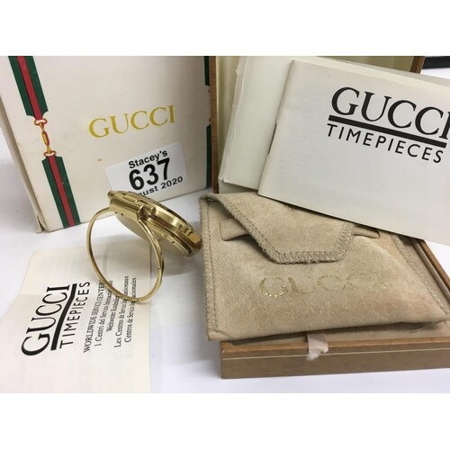 A Gucci Gold plated 0300 Bellissimo travel clock with origin...