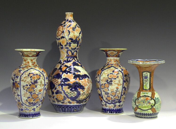 A Japanese Imari porcelain vase, Meiji period, the globular body and flared neck painted with panels