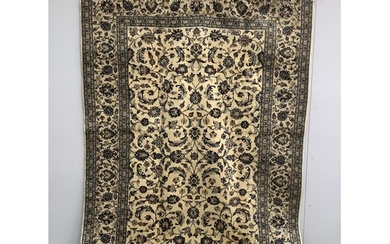 A Kashan ivory ground carpet, 302 x 196cm
