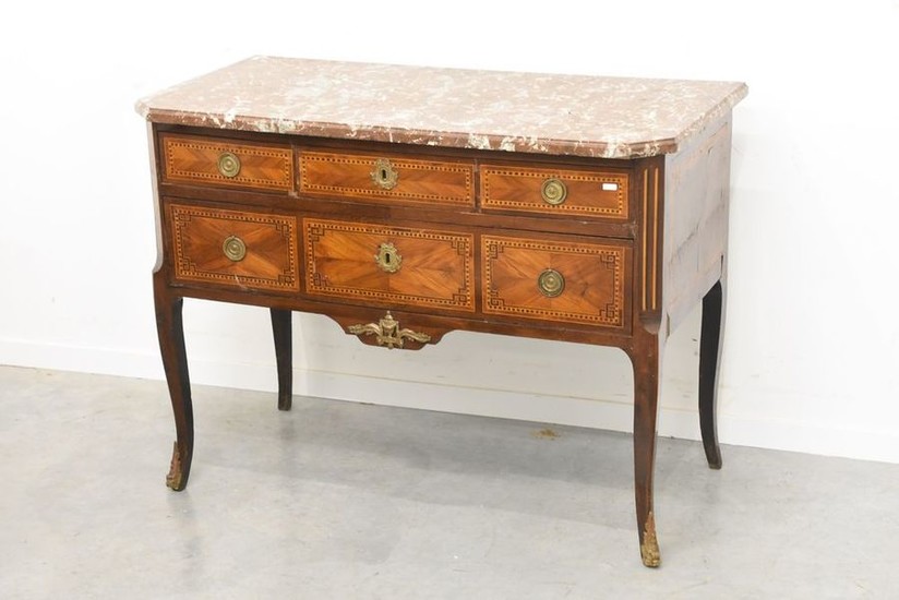 A Louis XVI period commode in marquetry, enhanced...