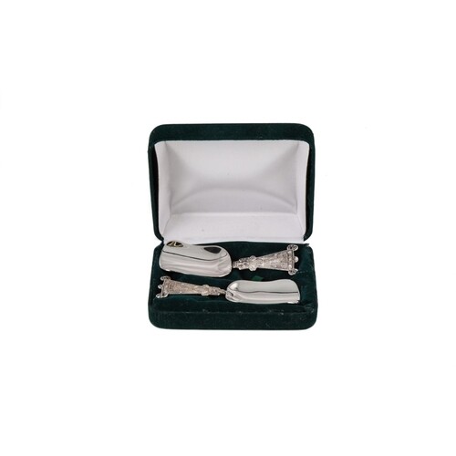 A MODERN PAIR OF IRISH SILVER CADDY SPOONS, with Celtic deco...